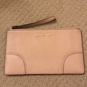 Brand new Michael Kors clutch with tags